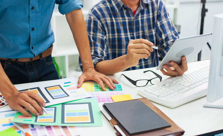 Men working on mobile app design