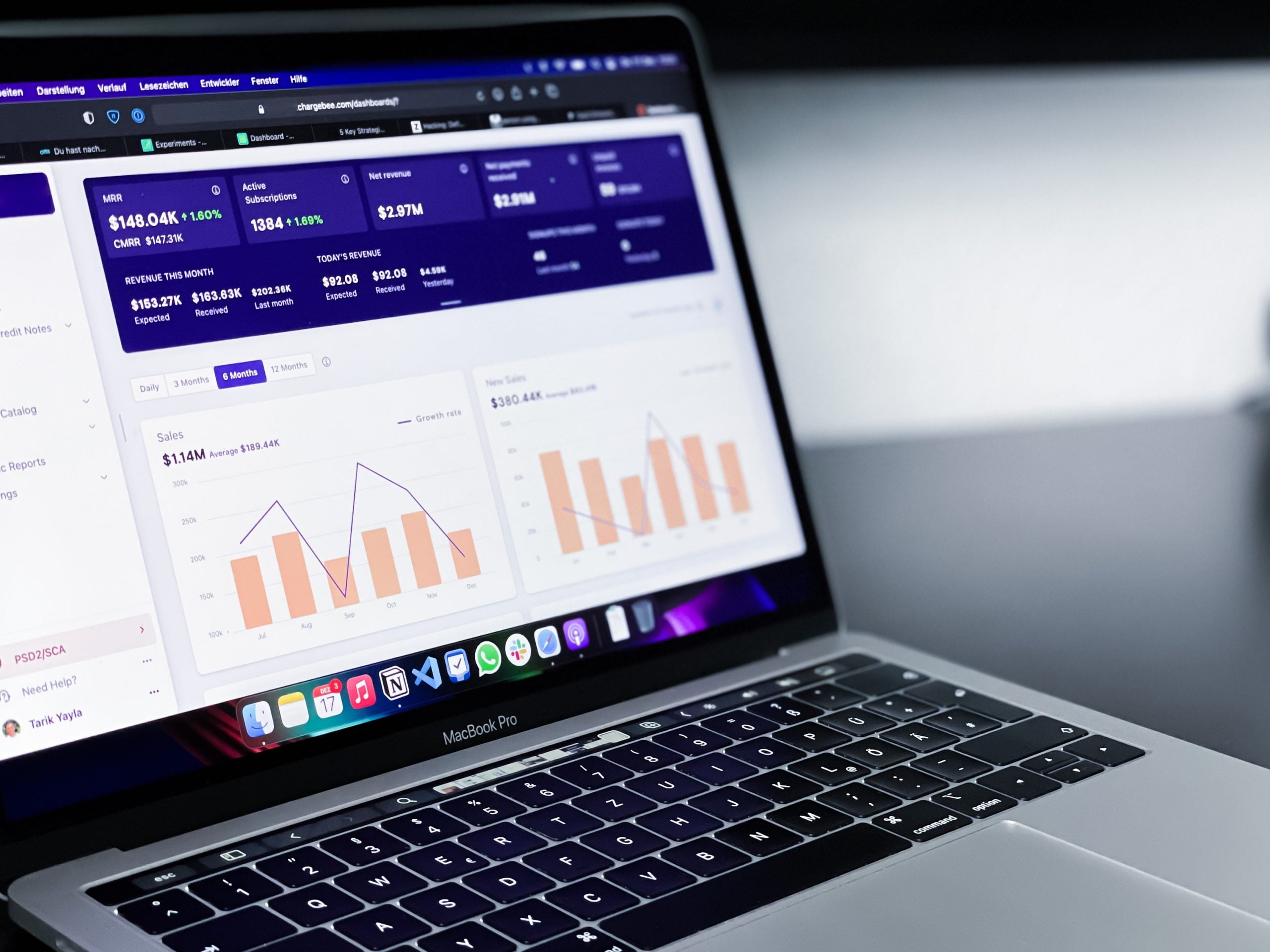 Analytics data from UTM tracking codes displayed on the laptop